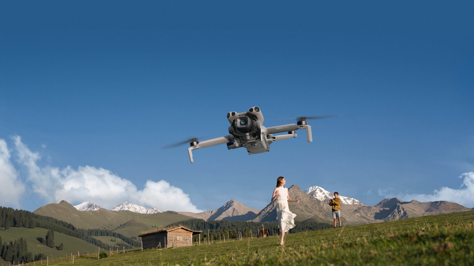 DJI Mini 5 Pro flying over a meadow