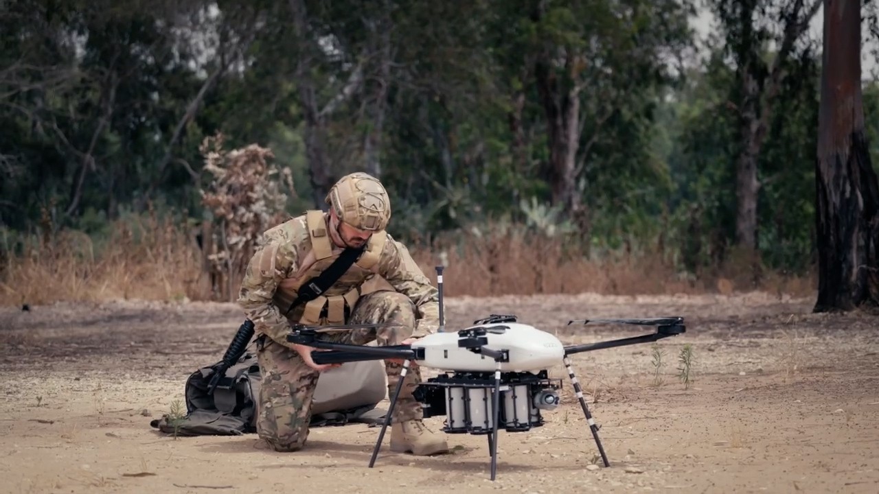 Soldier unfolding TerminaTHOR from its backpack