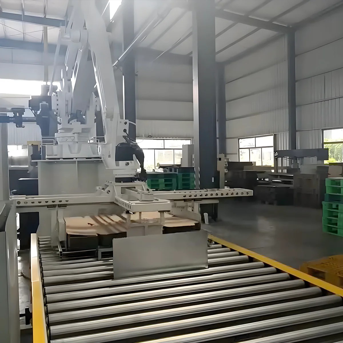 GOJON cardboard palletizer at the end of a roller line