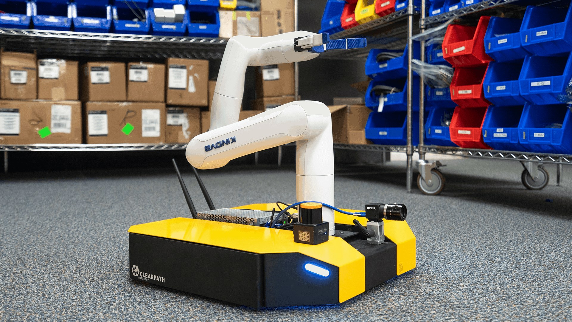 Kinova Gen3 lite on a Clearpath Dingo base in a warehouse