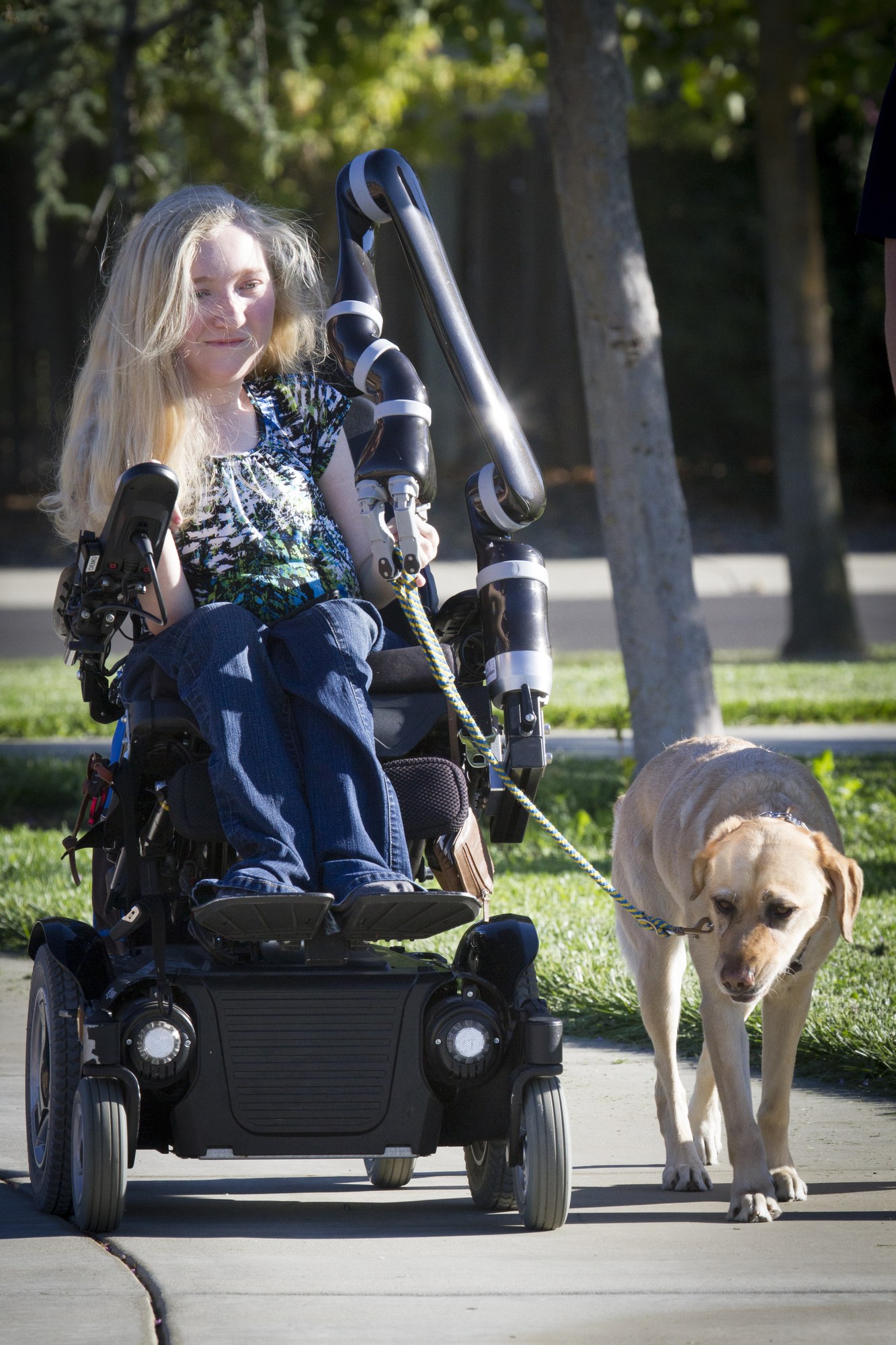 Kinova Jaco on a power wheelchair, outdoors