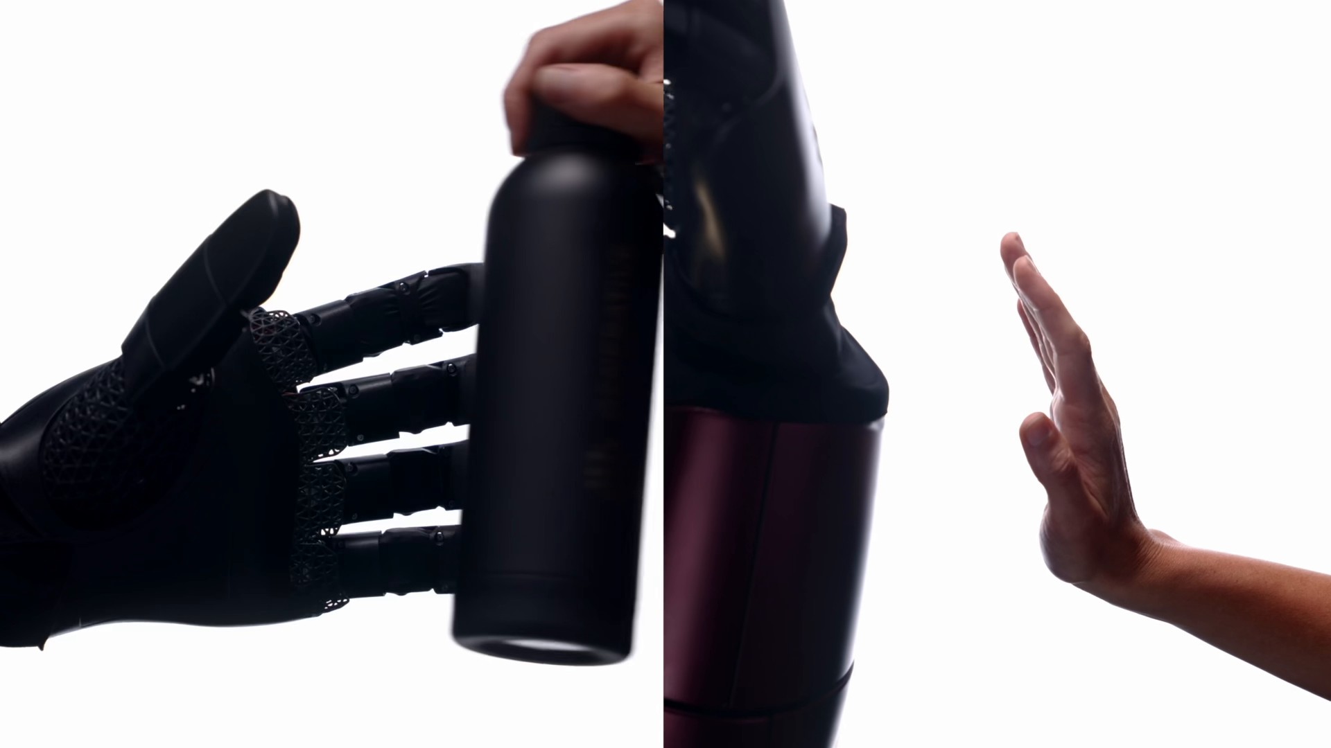 GENE.01 hand handling an object beside a human hand