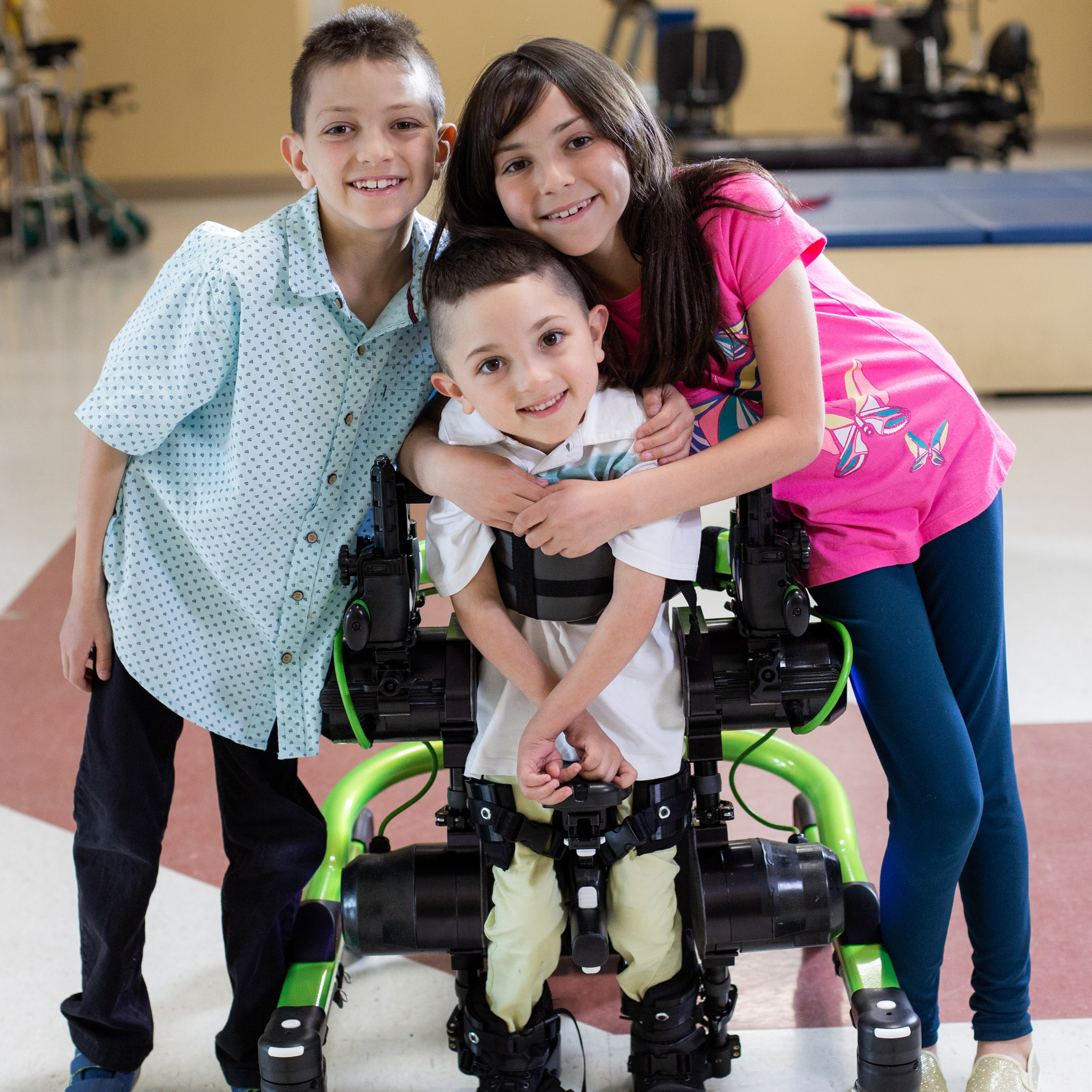 Child in a Trexo Plus with family